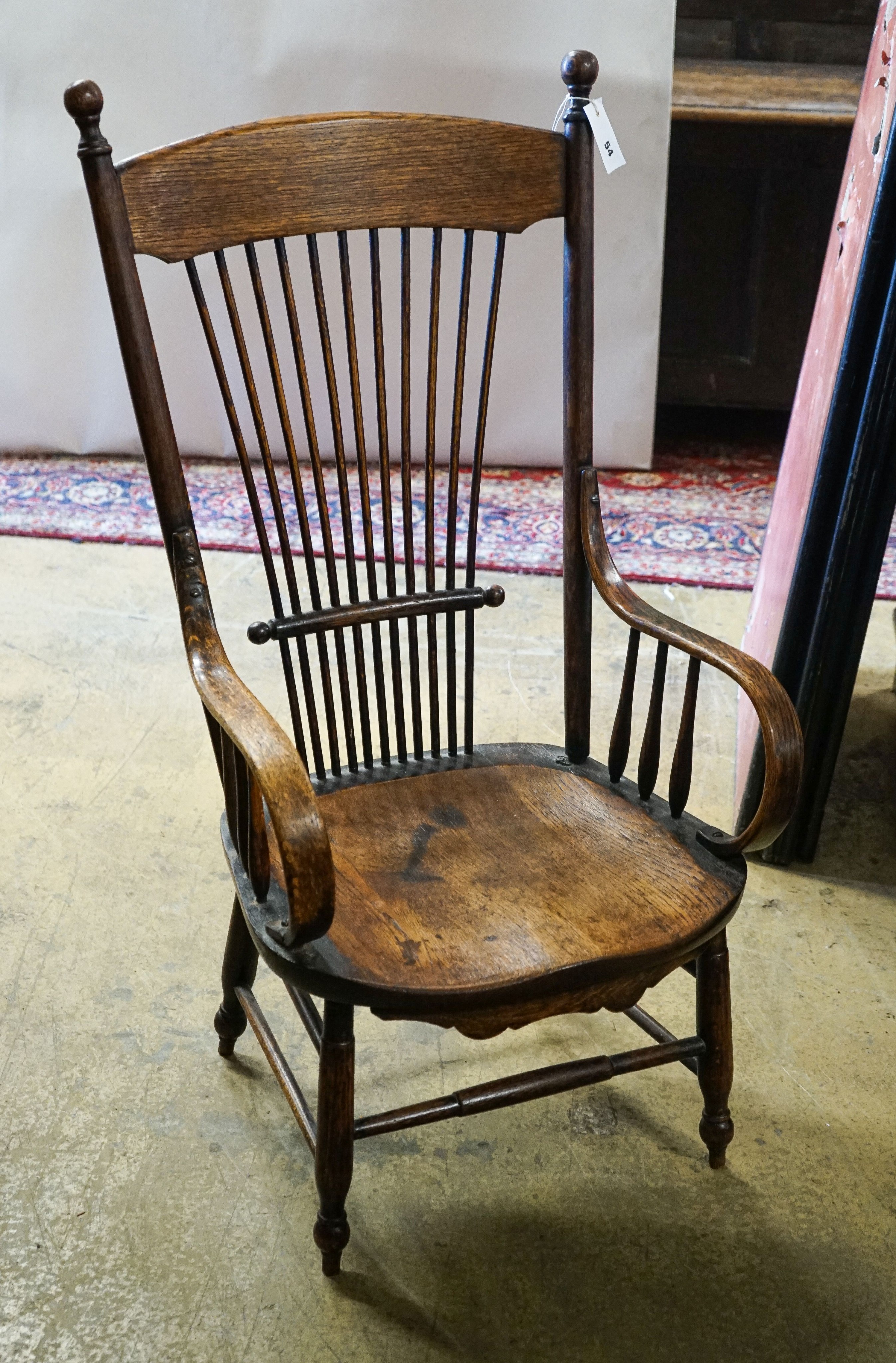 An early 20th century American ash and oak elbow chair, width 52cm, depth 42cm, height 100cm